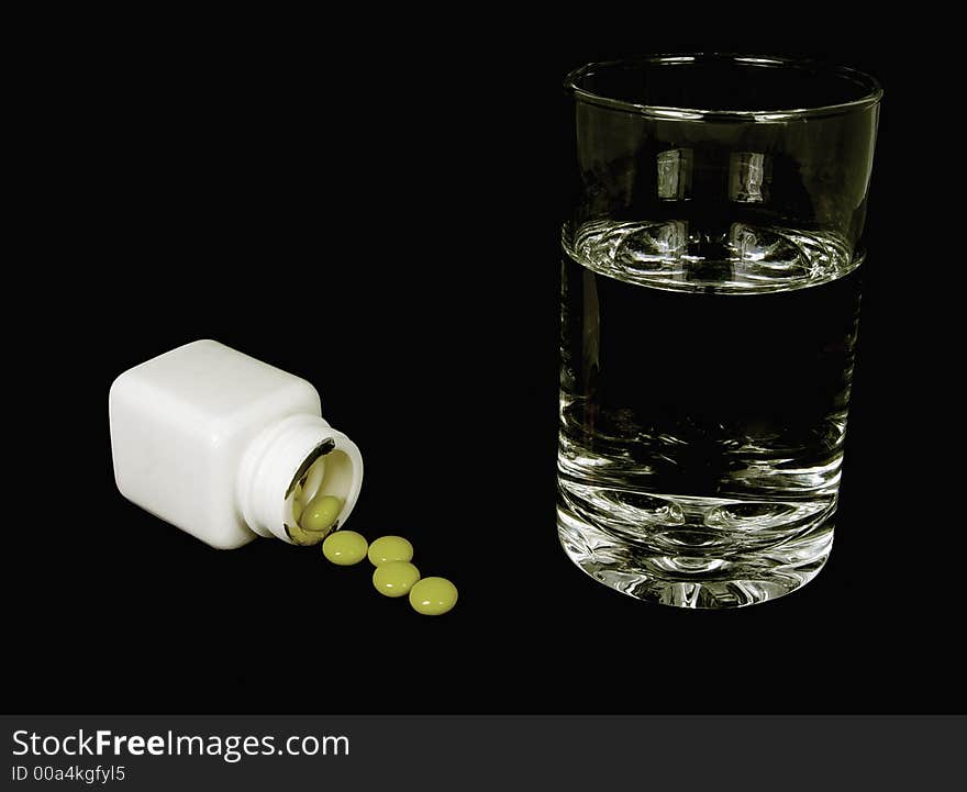 Photo of pills and a Glass Water