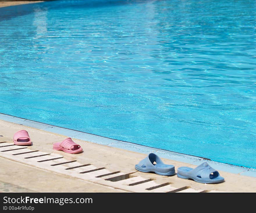 Boy and girl flip-flops at the pool