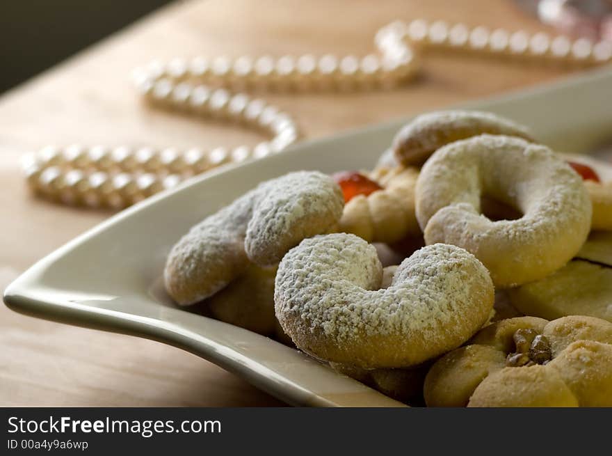 Sweet cookies decorated on a plate close up