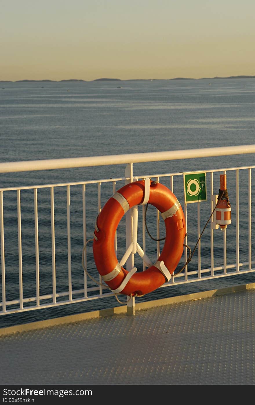 Picture of lifebuoy with rescue lamp on boat in Scandinavia.