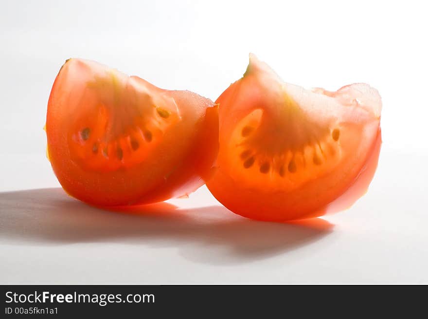 Tomato slices, lobules on the white