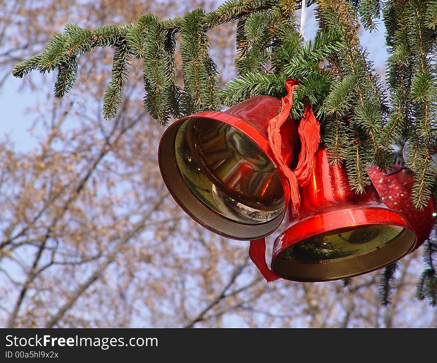 Christmas bells on the pine in the park