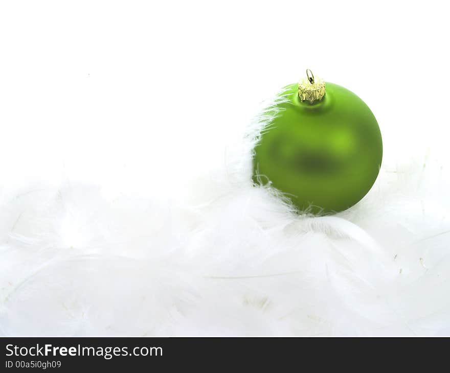 Christmas ball on white feathers. Christmas ball on white feathers