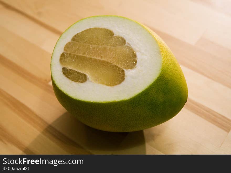 Pamelo fruit. Grapefruit on a kitchen table