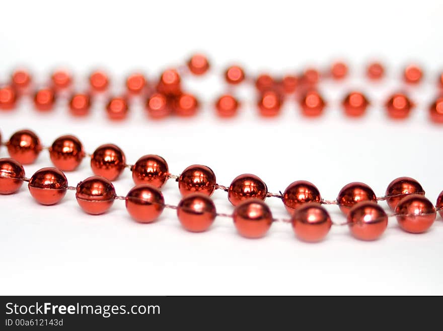 Red beads isolated on white. Decorations.