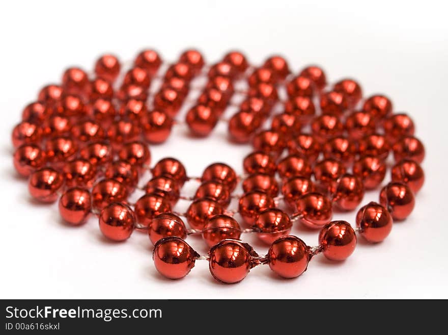 Red beads on white background