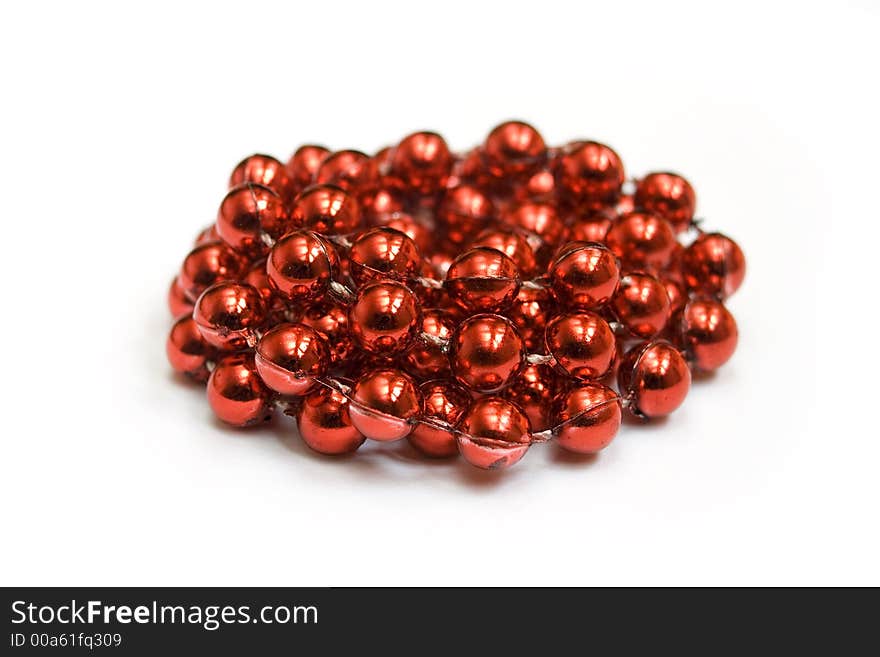 Pile of red beads isolated on white