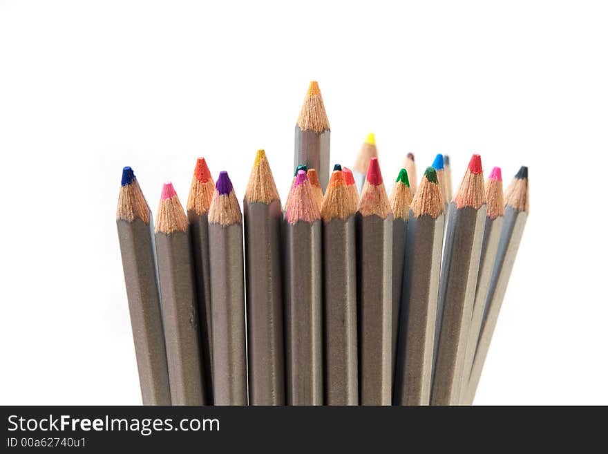 Stack of color pencils, crayons isolated against white