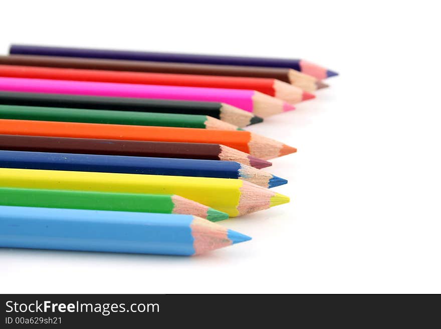 Colored pencils on a white background with a shallow DOF