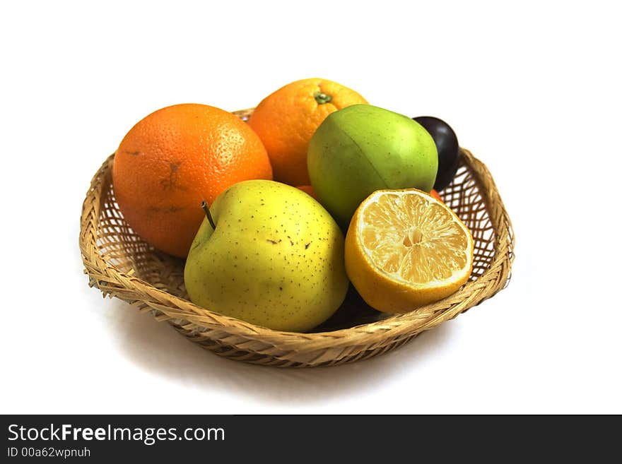 Fruit basket isolated on white background