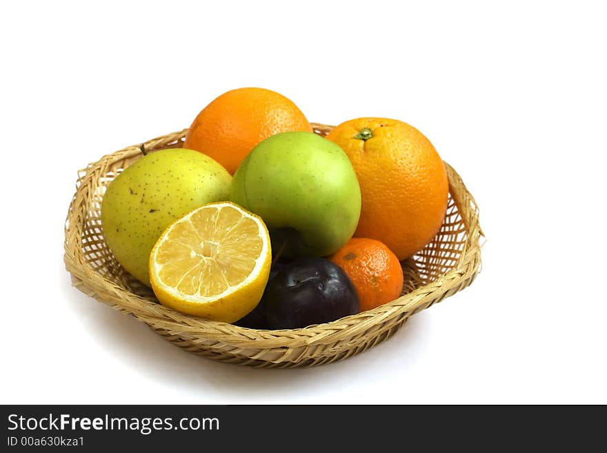 Fruit basket isolated on white