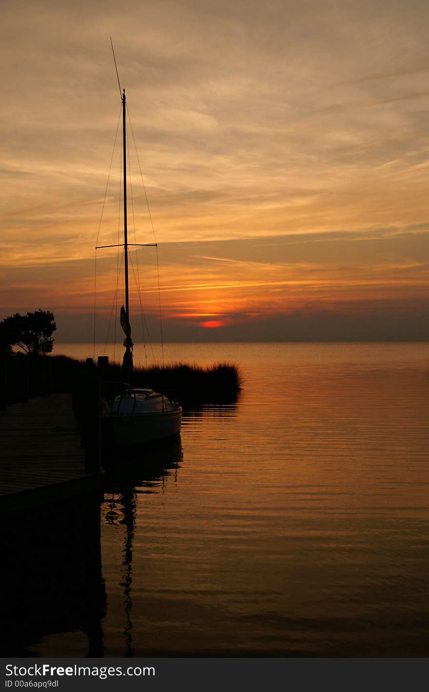 A beautiful silhouette of a boat at sunset. A beautiful silhouette of a boat at sunset