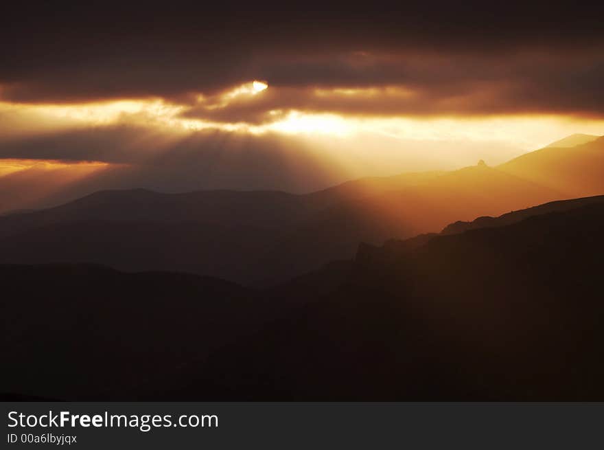 Storm weather,clouds and sun in mountain. Storm weather,clouds and sun in mountain