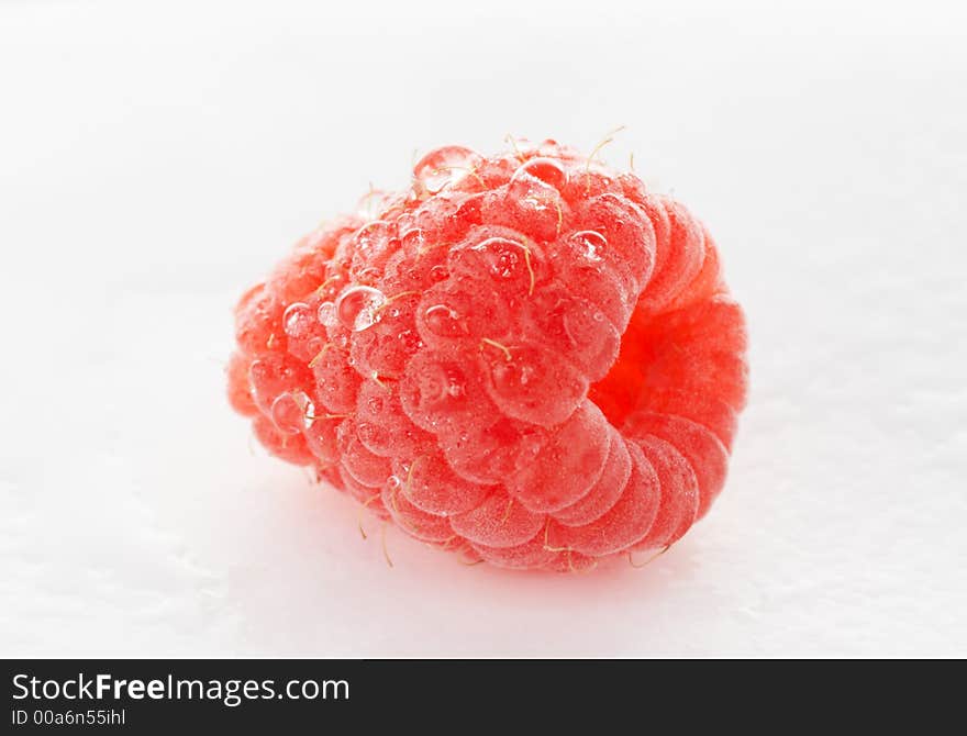 Fresh raspberry with water droplets