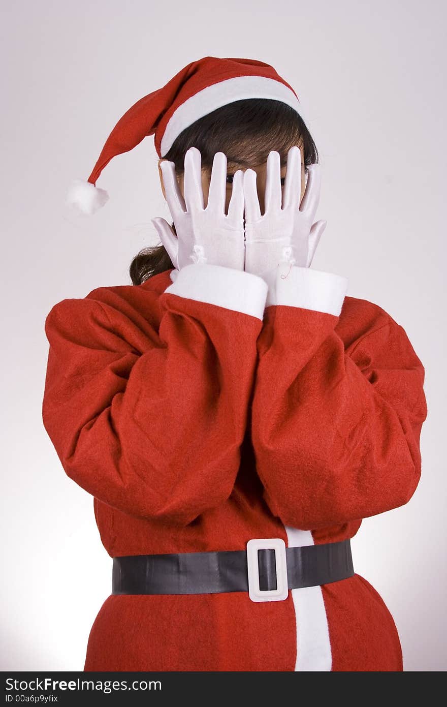 Asian girl showing See No Evil in Christmas Attire.