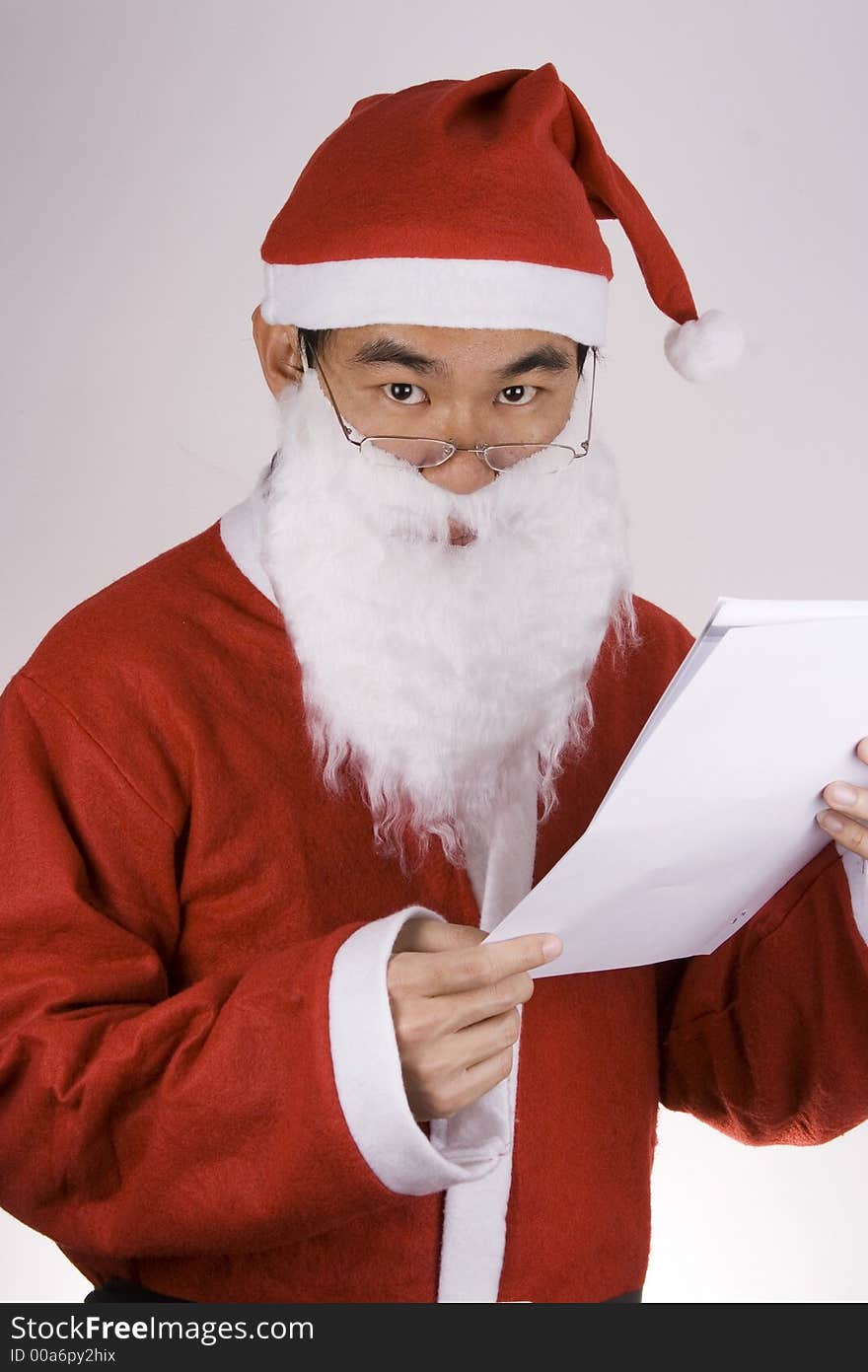 An Asian Santa Claus with check list.