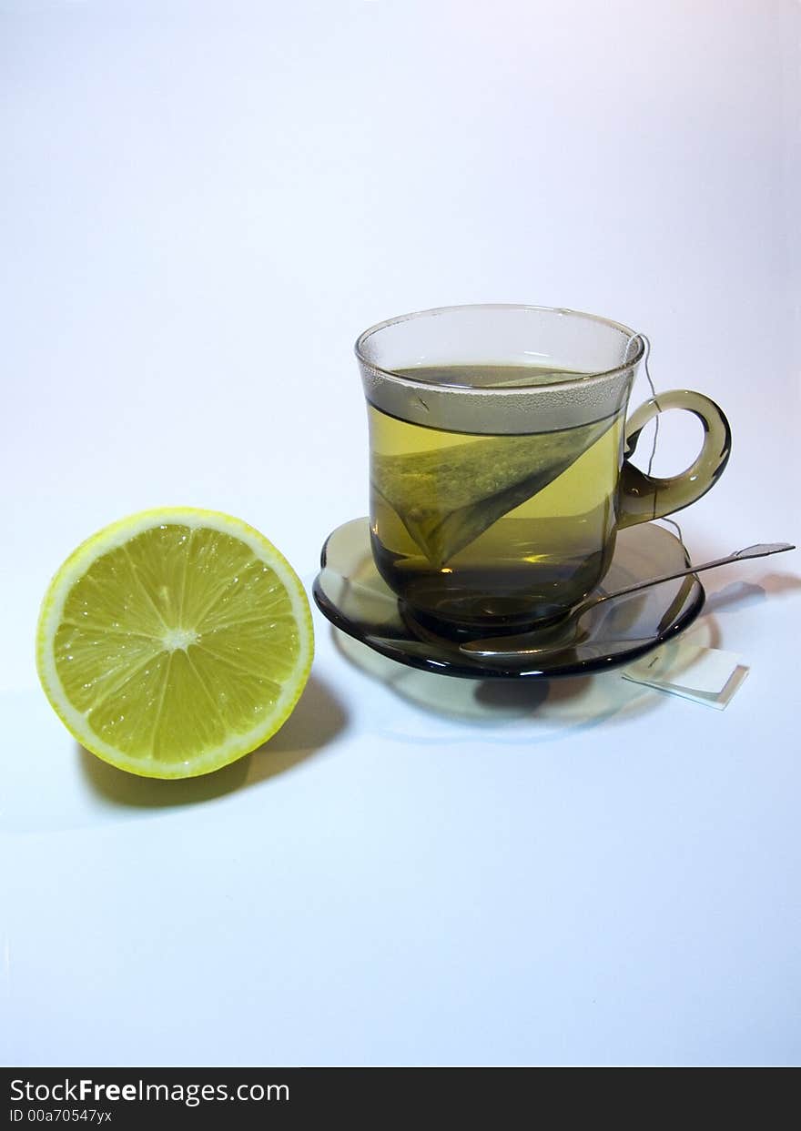 Small glass of tea with lemon