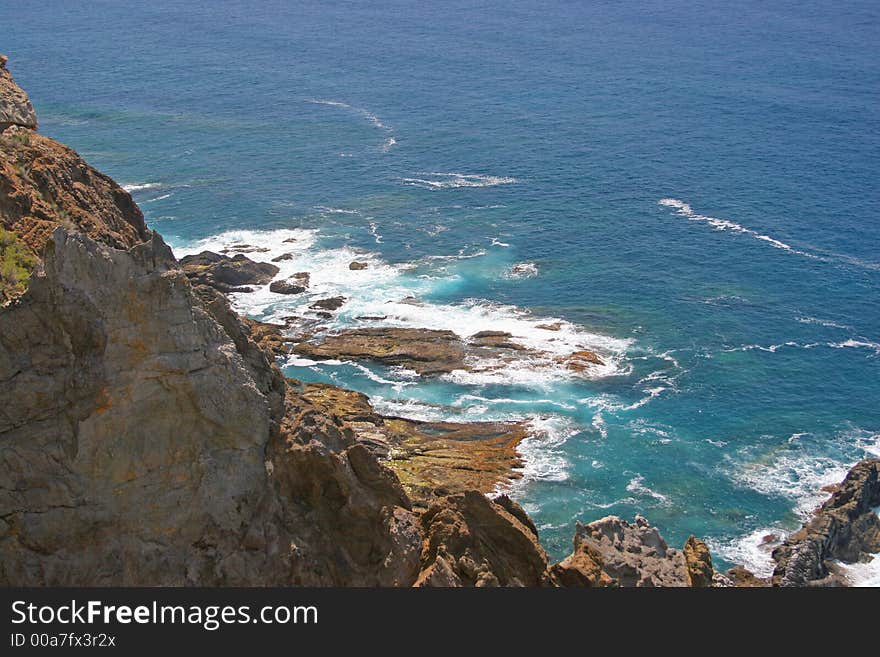 View down from a cliff into the water