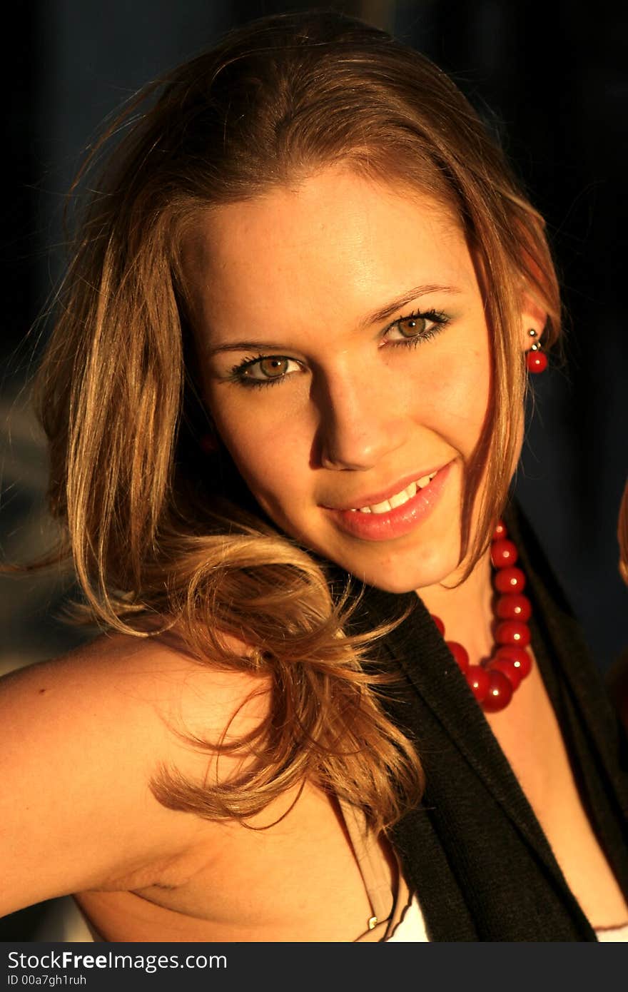 Outdoor Portrait of beautiful blond woman in natural light.