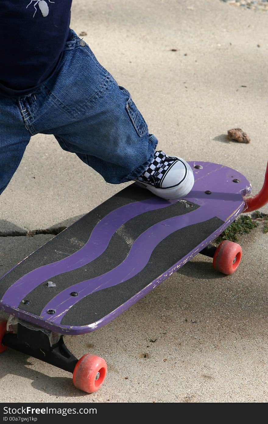 Childs foot on a skate-board, sport