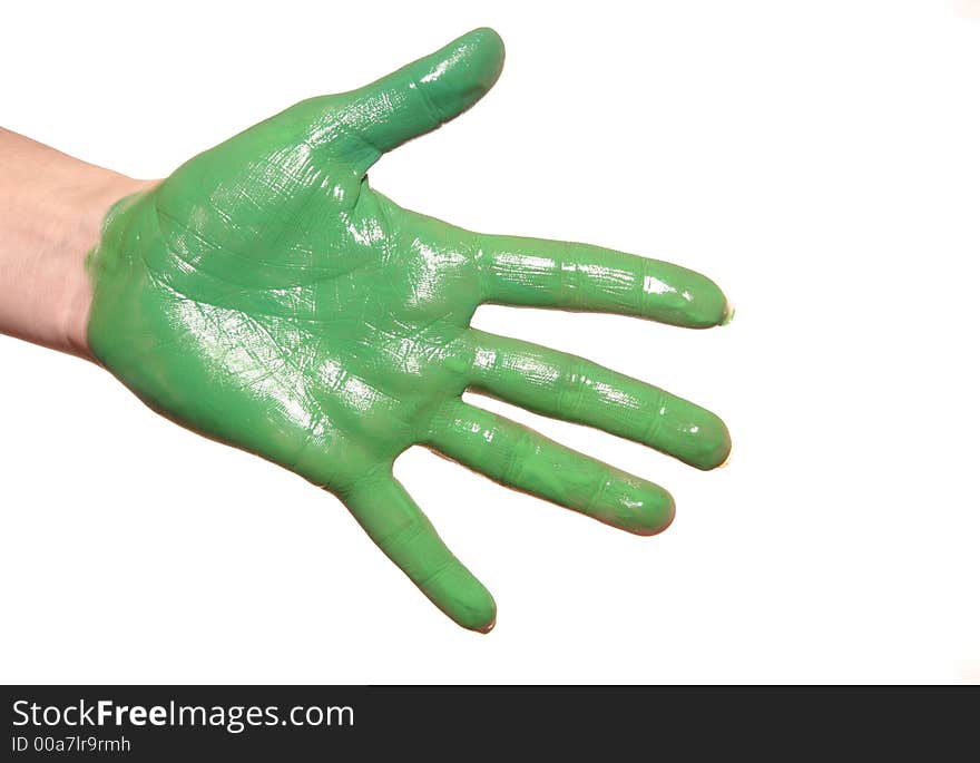 A womanish palm is painted green paints on a white background