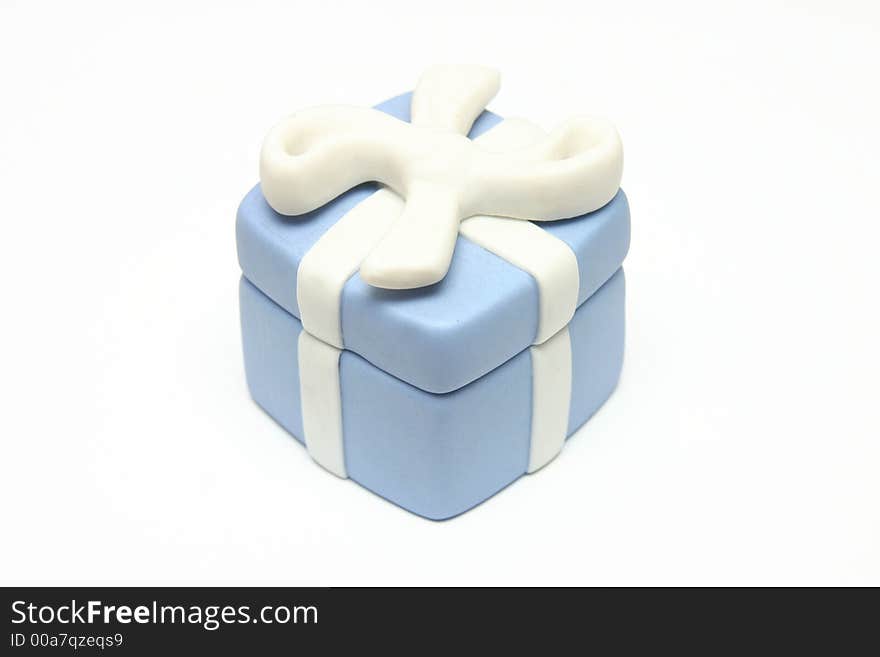 Blue Porcelain Gift Box with White Ribbon against white background