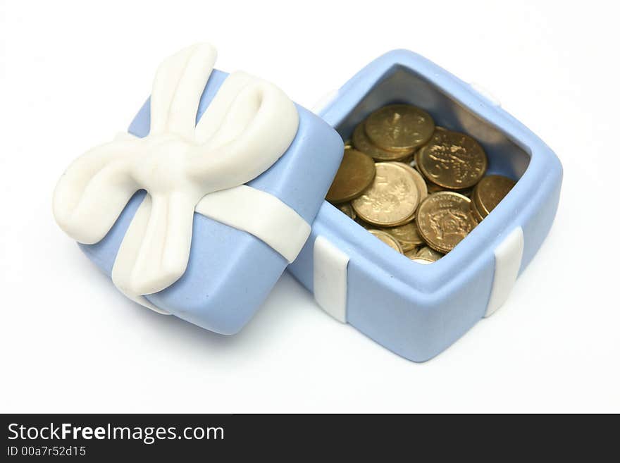 Blue Porcelain Gift Box filled with gold coins with White Ribbon against plain background