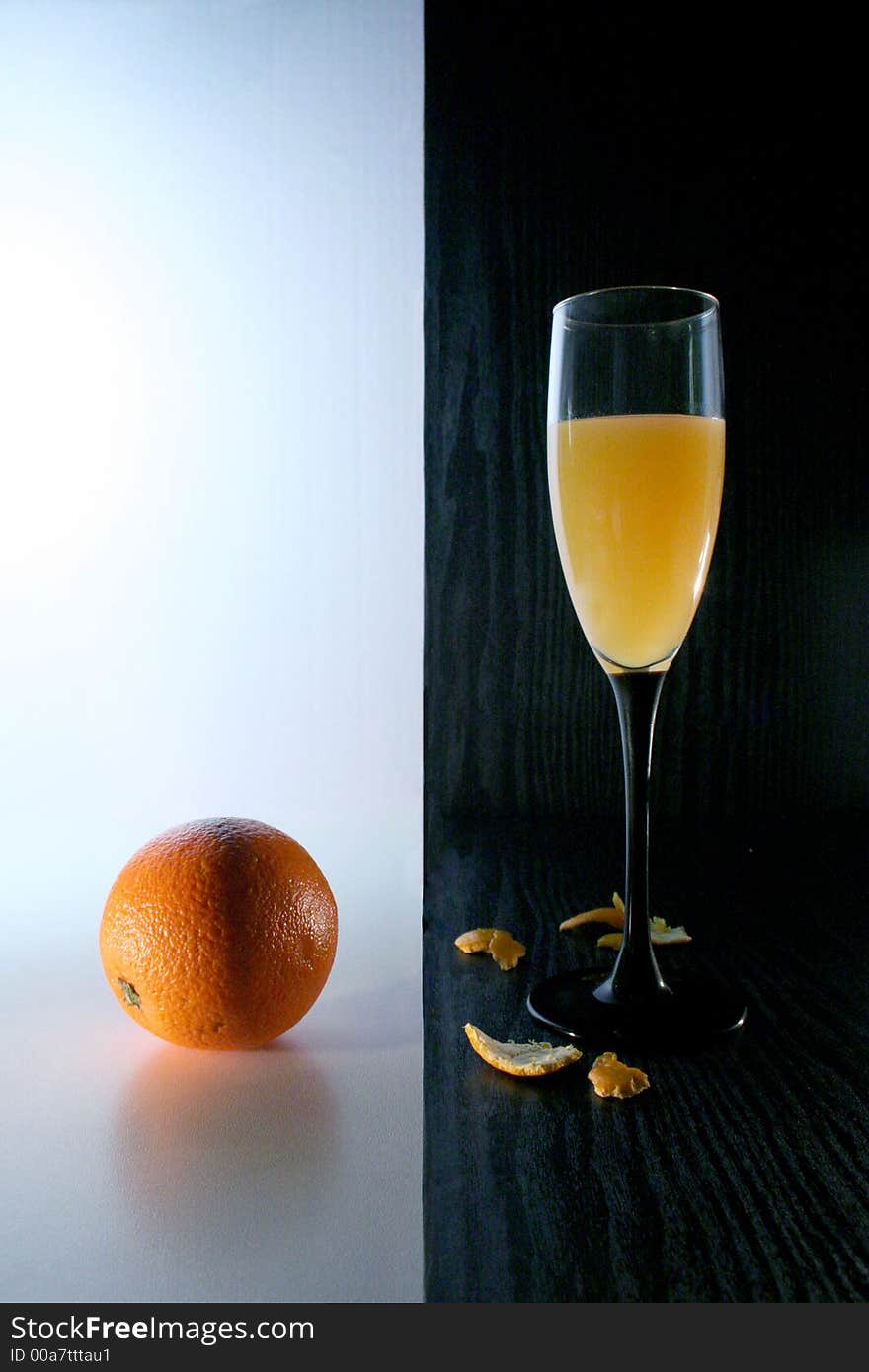 Orange juice and orange on white and black background. Orange juice and orange on white and black background