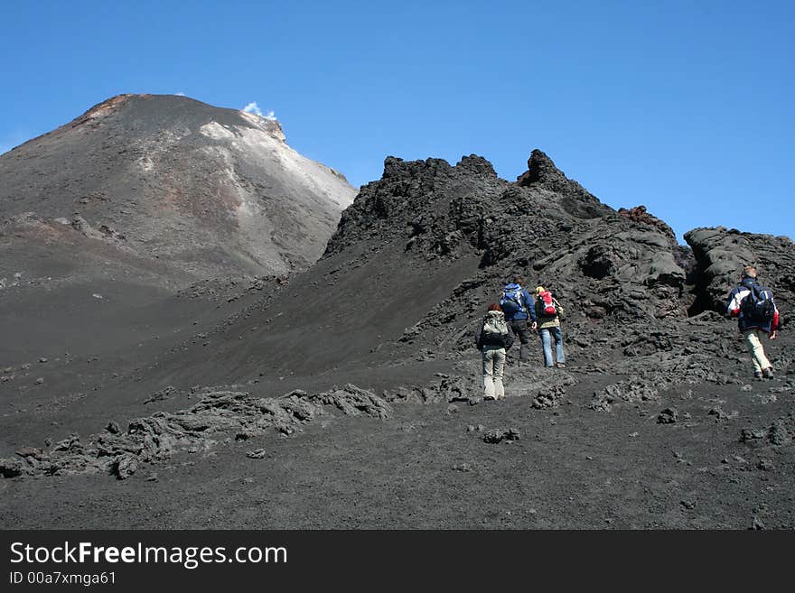 Hikers on volcano etna