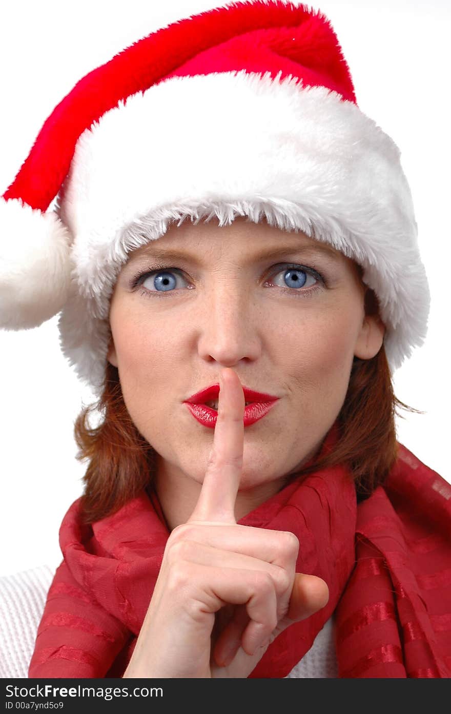 Woman with Santa's hat with silence sign