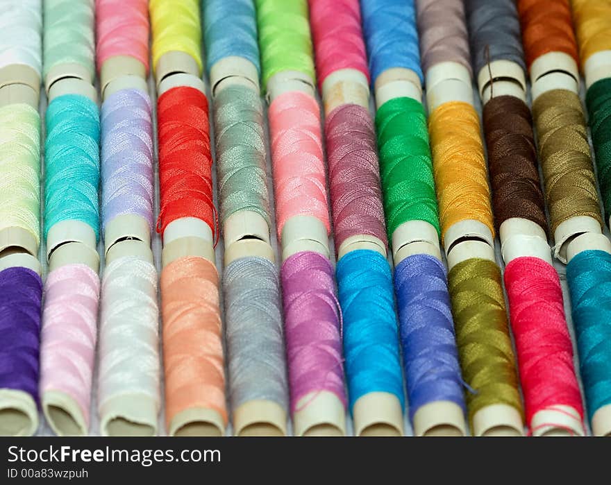 Macro shot with assorted colors reels of thread. Macro shot with assorted colors reels of thread