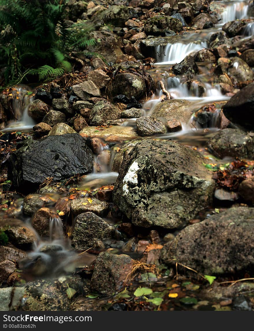 Small scottish  stream/river running down from the mountain side of ben nevis. Small scottish  stream/river running down from the mountain side of ben nevis.