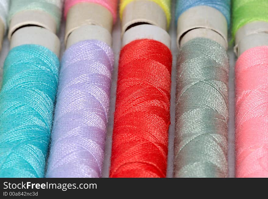 Macro shot with assorted colors reels of thread. Macro shot with assorted colors reels of thread