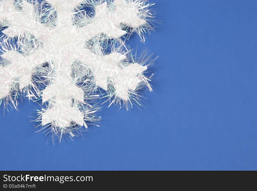 White snowflake on blue background