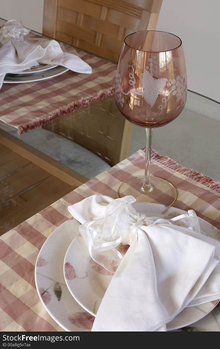 Wine glass and table setting. Wine glass and table setting