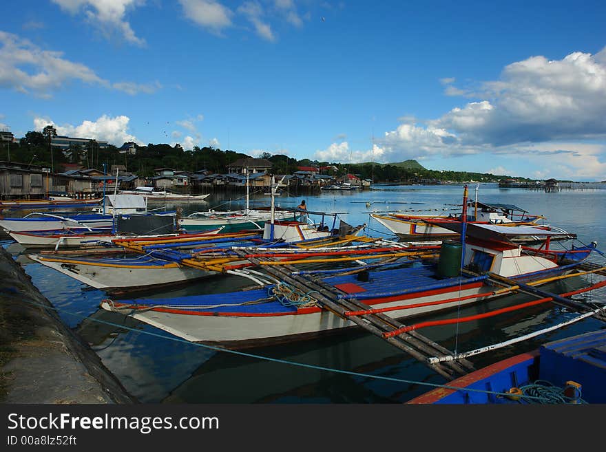 Asian village port with fishermen�s boats.