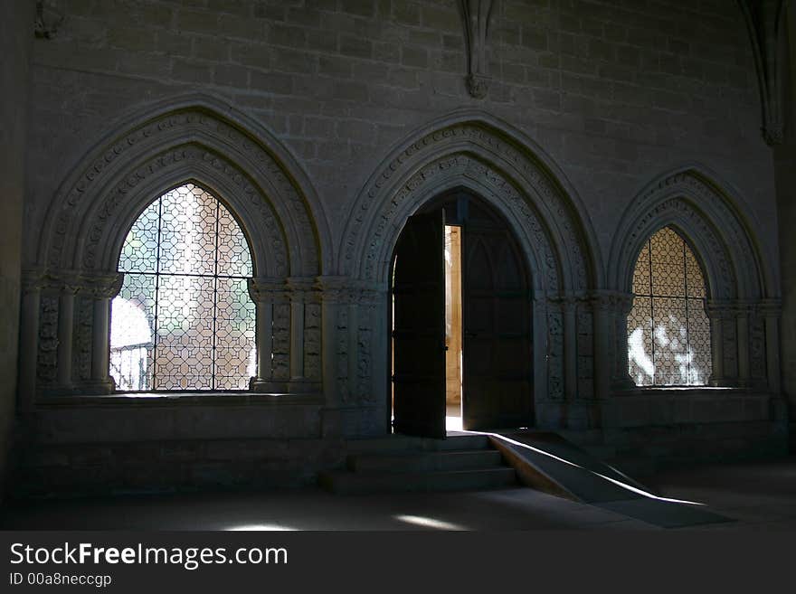 Door and windows in a european monastery, possible concepts: enclosed, freedom. Door and windows in a european monastery, possible concepts: enclosed, freedom