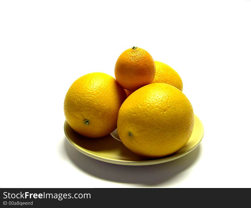 Tangerine and oranges on a plate