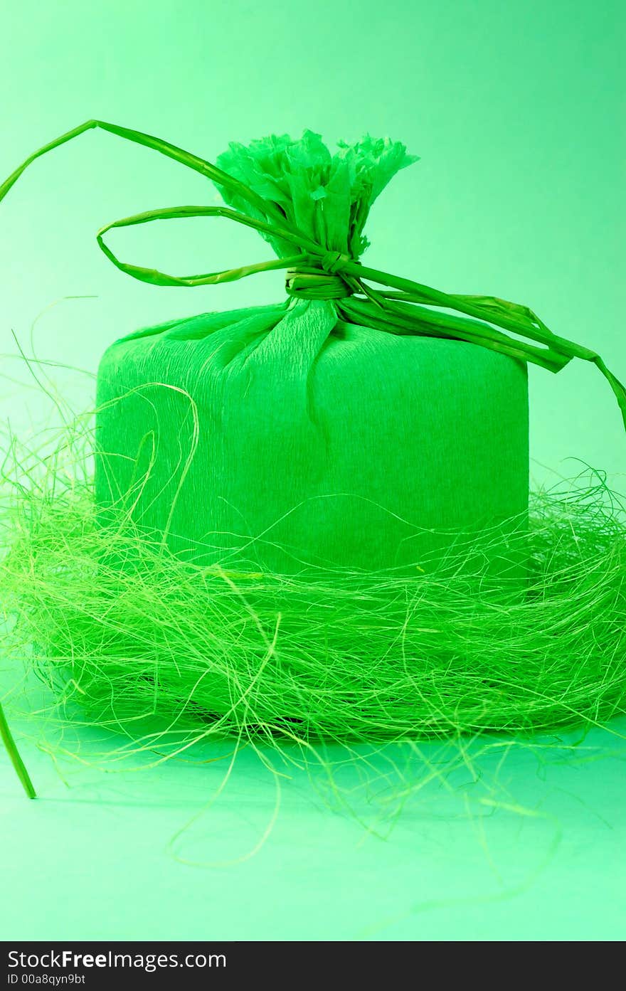 Green present with green ribbon.Present box. Green present with green ribbon.Present box.