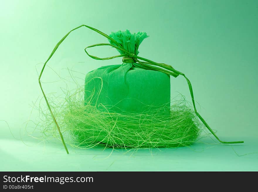 Green present with green ribbon.Present box. Green present with green ribbon.Present box.