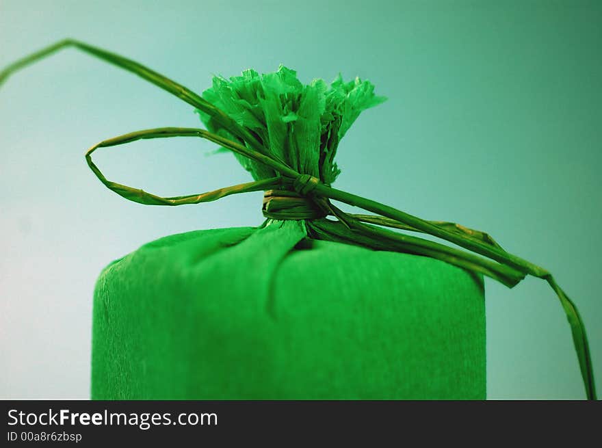 Green present with green ribbon.Present box. Green present with green ribbon.Present box.