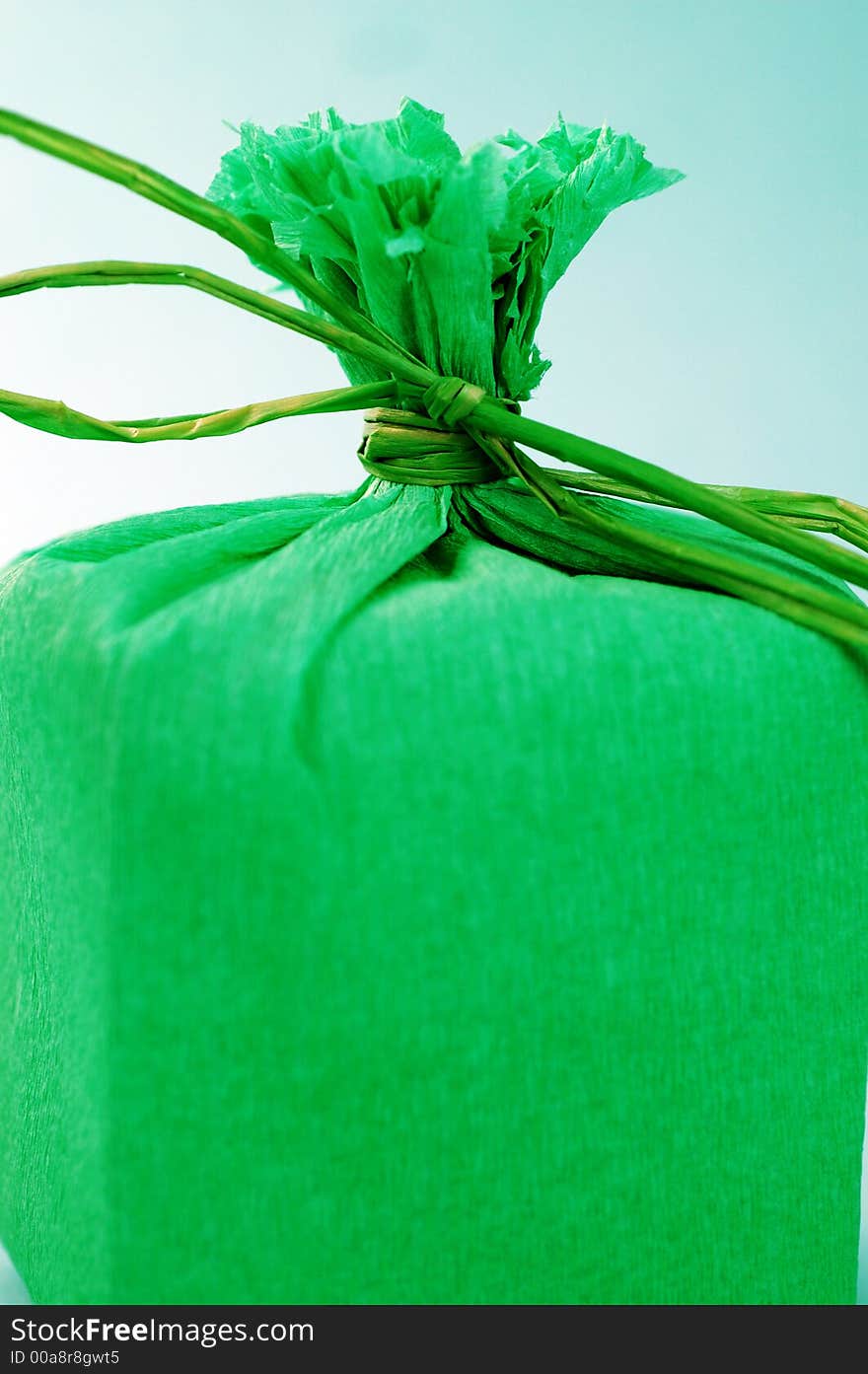 Green present with green ribbon.Present box. Green present with green ribbon.Present box.