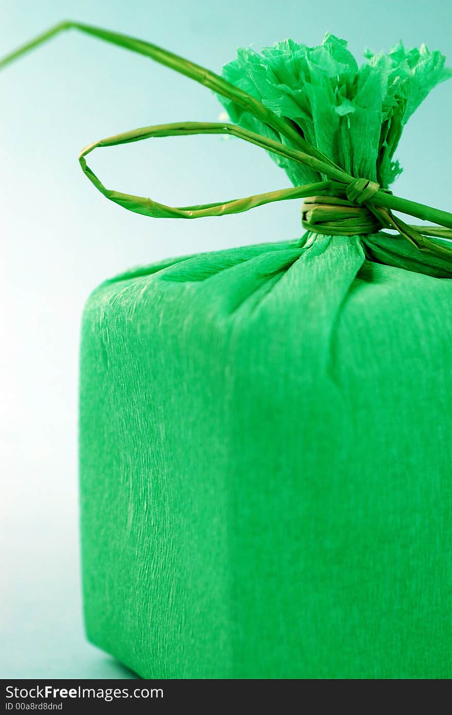 Green present with green ribbon.Present box. Green present with green ribbon.Present box.