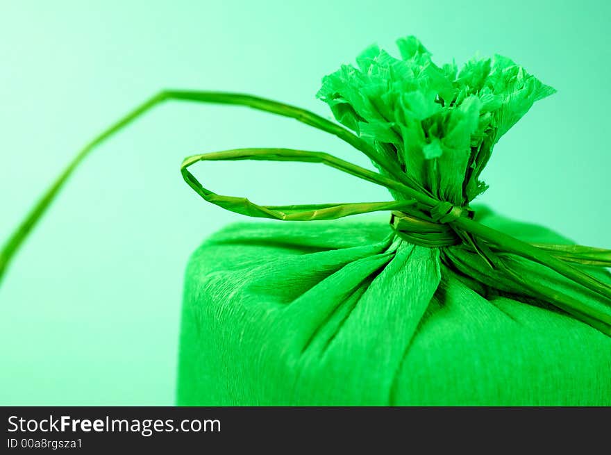 Green present with green ribbon.Present box. Green present with green ribbon.Present box.