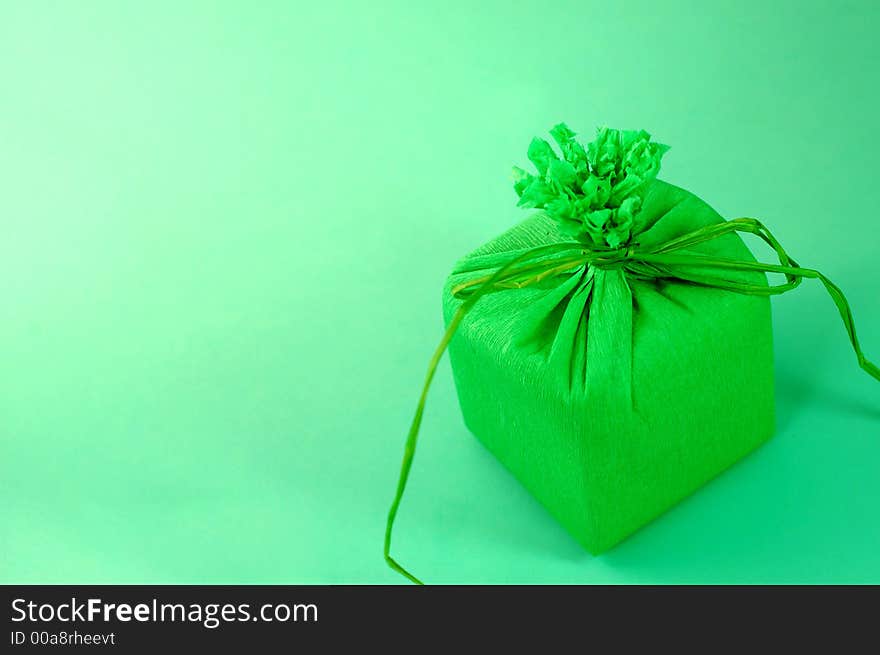 Green present with green ribbon.Present box. Green present with green ribbon.Present box.