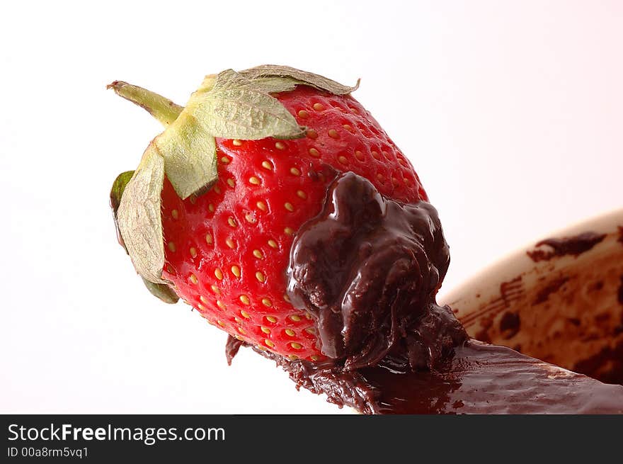 Closeup of strawberry on chocolate. Closeup of strawberry on chocolate