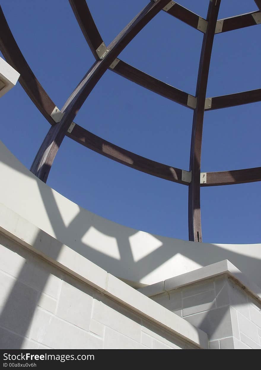 Blue sky seen through a garden portico. Blue sky seen through a garden portico