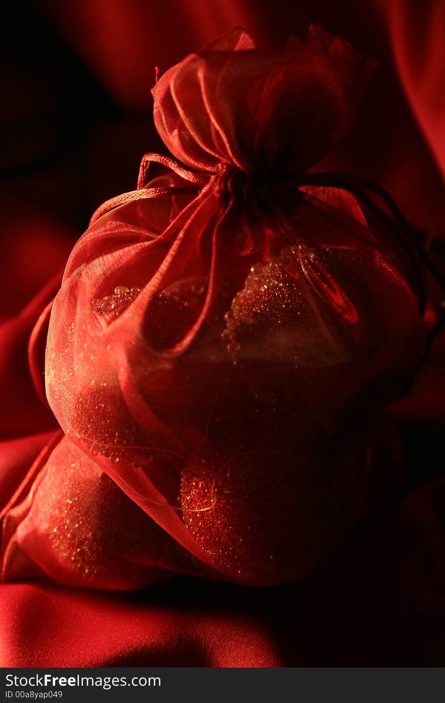 Christmas decorations in the red bag with red bakcground