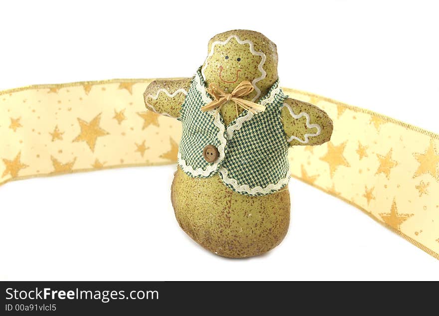 Gingerbread man against gold ribbon with stars - isolated. Gingerbread man against gold ribbon with stars - isolated