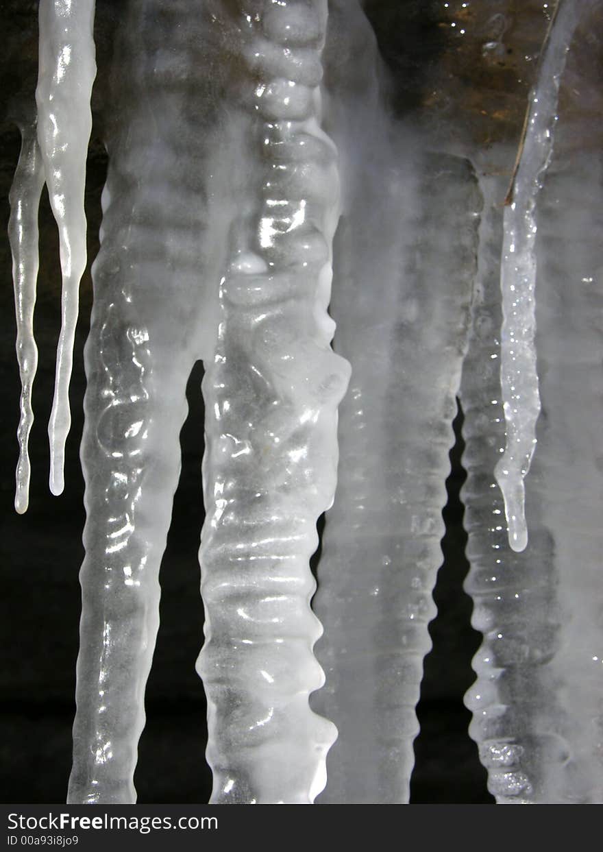 Mutiple icicles on black background